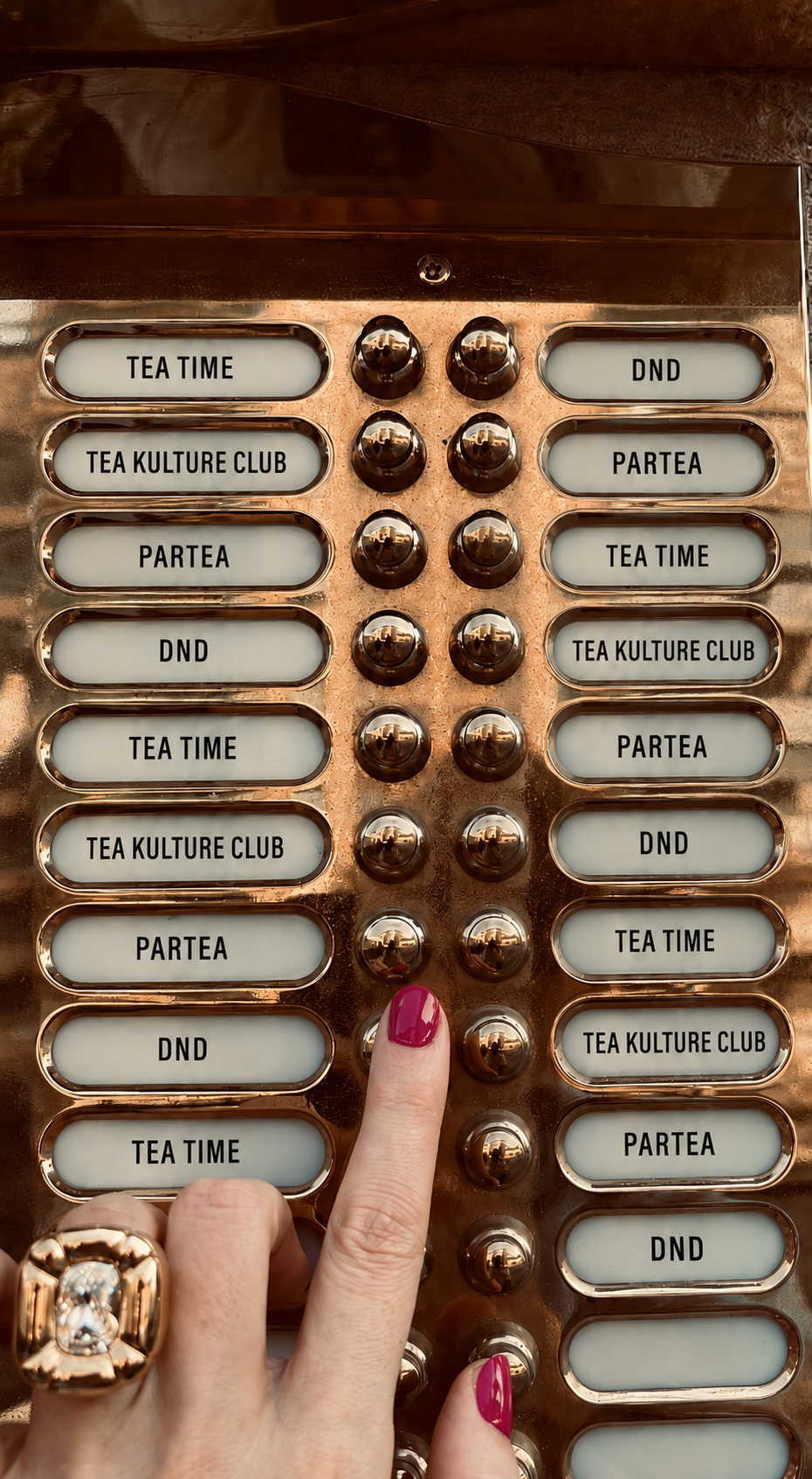 Vintage brass elevator panel with Tea Kulture Club and Partea buttons